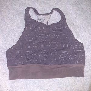 Alo Yoga sports bra in lavender. Cut out design throughout with mesh at bottom